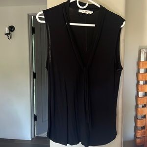 Viscose drapes nicely.  sleeveless blouse with a tie in front.